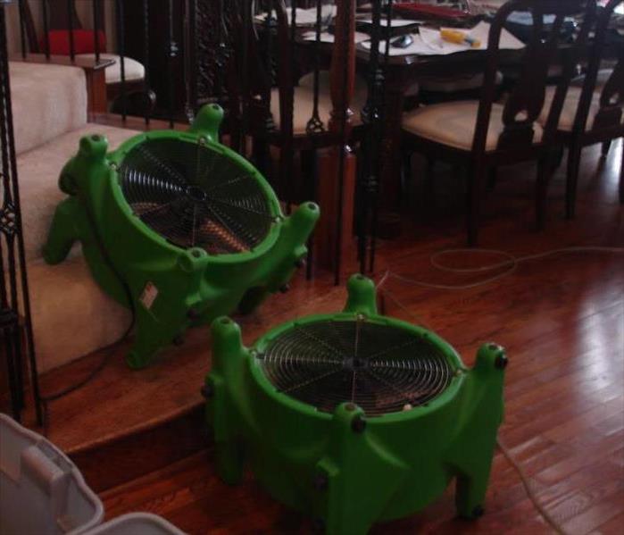 Equipment axial fans isolating air to water damaged wood floors