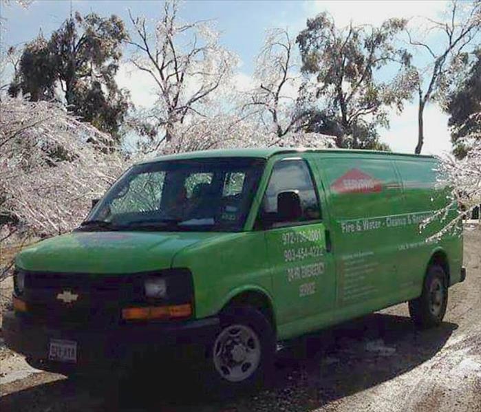 SERVPRO van in front of frozen trees with ice on road