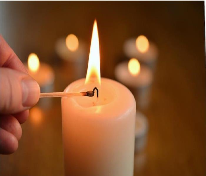 Candle being lit with match